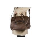 GIANNI VERSACE: A BROWN LEATHER HANDBAG WITH FRONT FLAP CLOSING