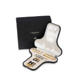 ALFRED DUNHILL: A LIMITED EDITION "CHARLSTON" SILVER GILT GIFT SET