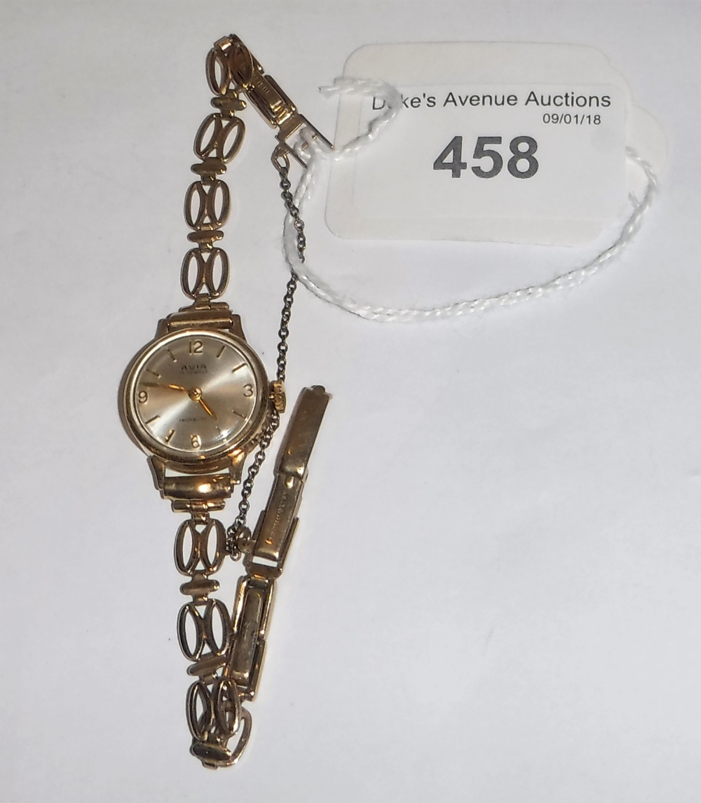 A LADIES AVIA YELLOW GOLD WRISTWATCH on a yellow gold 9ct strap