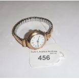 A LADIES VINTAGE YELLOW GOLD 9CT WRISTWATCH on an expandable strap