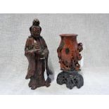 A CARVED WOODEN FIGURE OF A CHINESE SCHOLAR and a similar soapstone vase