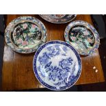 A PAIR OF ORIENTAL CHARGERS decorated with birds, 14.5" dia. and an Oriental blue and white charger,