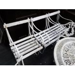 THREE WROUGHT IRON AND WOODEN SLATTED GARDEN SEATS