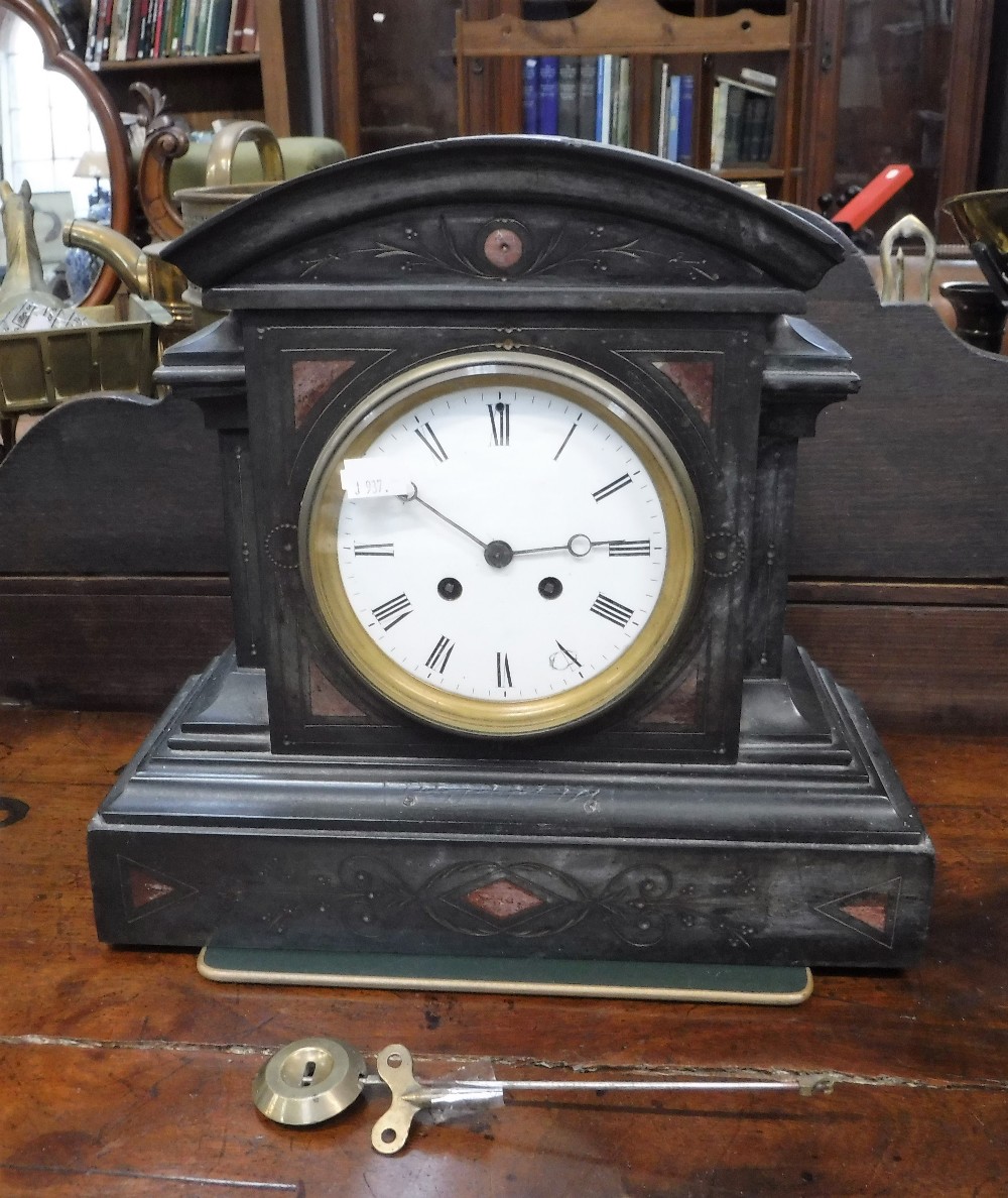 A VICTORIAN SLATE CASED MANTEL CLOCK (pendulum and key in office)