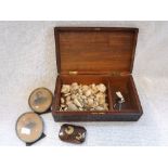 AN INDIAN CARVED AND BRASS INLAID BOX containing seashells, Edwardian photograph frames and a