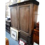 A GEORGE III STYLE OAK CUPBOARD with fielded panelled doors, 73.5" high x 61" wide