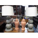 A PAIR OF CONTEMPORARY TABLE LAMPS in the form of three graduated spheres, with cream shades and a