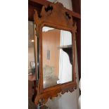 A GEORGE III STYLE WALNUT FRAMED WALL MIRROR, 28" high