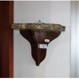 A VICTORIAN MAHOGANY WALL BRACKET/SHELF with a raised and pierced gallery, 8" high