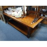 A SOLID OAK COFFEE TABLE of rectangular form, 18" high x 24" wide x 52" long and a child's high