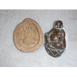 A BRONZE ARHATT BUDDHA INCENSE BURNER and a terracotta plaque