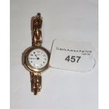 A J.W. BENSON YELLOW GOLD 9CT WRISTWATCH on an expandable strap