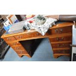 A REPRODUCTION YEW PEDESTAL DESK with inset green leather top, 31" high x 54" wide