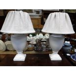 A PAIR OF CONTEMPORARY WHITE PAINTED TABLE LAMPS of 'urn' form with 'muslin' shades