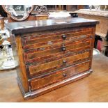 A VICTORIAN FIGURED WALNUT AND EBONISED MINIATURE CHEST OF FOUR DRAWERS, 10.75" high x 14.25" wide