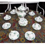A ROCKINGHAM STYLE TEASET decorated with green flowers