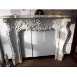 A VICTORIAN ' LOUIS QUINZE' STYLE WHITE PANTED WOODEN FIRE SURROUND, with ribbon, swag, acanthus and