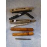 A COLLECTION OF GLASS THERMOMETERS, some in wooden holders and leather cases