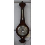 A REGENCY ROSEWOOD WHEEL BAROMETER, the circular silvered dial signed "Logan Dorchester", 41" high