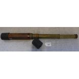 A THREE DRAW BRASS TELESCOPE with leather grip and covers