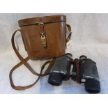 A PAIR OF VINTAGE BINOCULARS IN LEATHER CASE