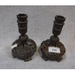 A PAIR OF CONTINENTAL COPPER CANDLESTICKS with pierced and scroll decoration, probably 19th century,