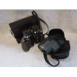 A PAIR OF PENTAX 8-20X24 UCF ZOOM BINOCULARS in leather case and one other pair of binoculars (2)