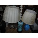 A GREEN GLAZED POTTERY VASE, converted to a table lamp and a selection of other table lamps, some