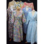 A COLLECTION OF VINTAGE CLOTHING including a full length threequarter length sleeve wrap around