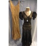 A GOLD AND CREAM STRIPED SLEEVELESS LAWN TEA DRESS and a black chiffon and lace evening dress with