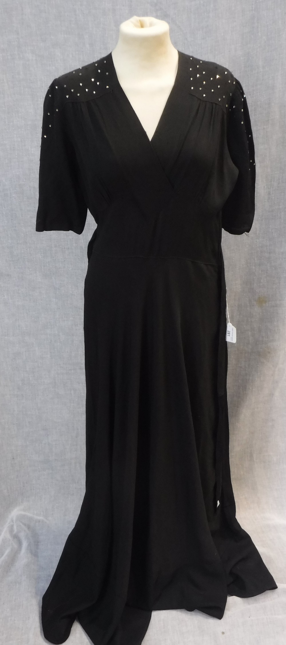 A FULL LENGTH BLACK CREPE EVENING DRESS, the shoulders and sleeves decorated with clear beadwork, - Image 2 of 4