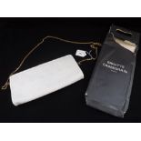 CHRISTIAN DIOR: A CREAM CLUTCH BAG with a long chain handle, the interior stamped 'Christian Dior,