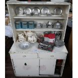 A VINTAGE CHILD'S KITCHEN DRESSER with a collection of period pots, pans, cutlery and tea set, circa