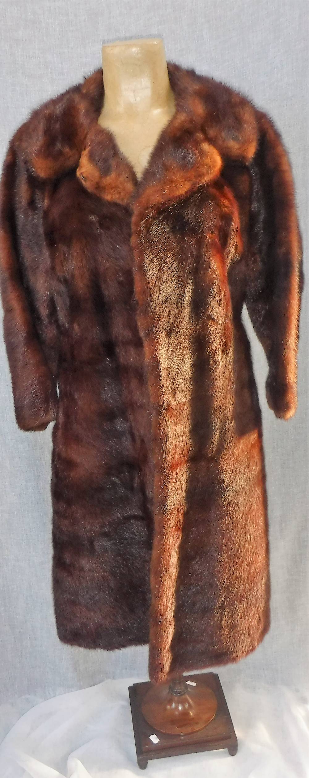 A BROWN MINK FUR COAT, with threequarter length sleeves