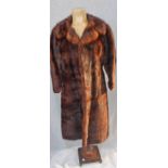 A BROWN MINK FUR COAT, with threequarter length sleeves