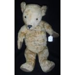 A VINTAGE PLUSH TEDDY BEAR with jointed head and limbs and brown velvet pads, 20" high