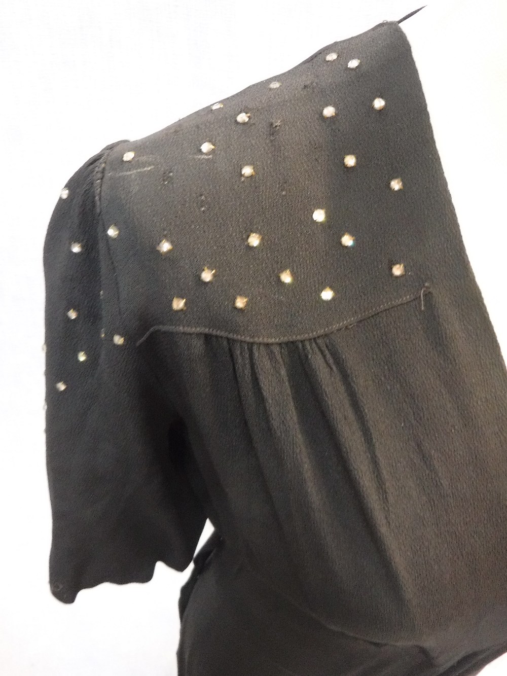 A FULL LENGTH BLACK CREPE EVENING DRESS, the shoulders and sleeves decorated with clear beadwork, - Image 3 of 4