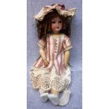 AN EARLY 20TH CENTURY "SCHOENAU & HOFFMEISTER" DOLL with a ceramic head, stamped "S H, PB