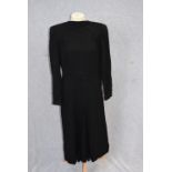 A BLACK FULL LENGTH LONG SLEEVE DAY DRESS, the back with button decoration, the skirt with central