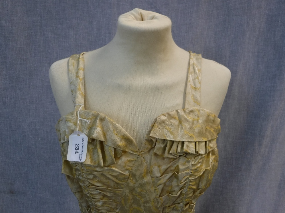 A FULL LENGTH YELLOW BROCADE EVENING DRESS, the rouched fitted bodice falling into a full skirt, - Image 2 of 3