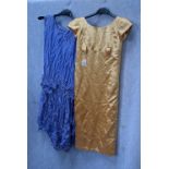 A CHILD'S BLUE SLEEVELESS PARTY DRESS, with dropped waistline and one other gold party dress,