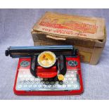 A VINTAGE TIN PLATE 'METTYPE' JUNIOR WORKING TOY TYPEWRITER with original box