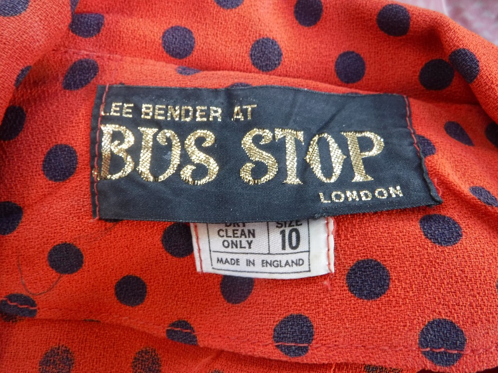 LEE BENDER AT BUS STOP, LONDON: A FULL LENGTH RED AND NAVY SPOTTED DAY DRESS, with full length - Image 3 of 4