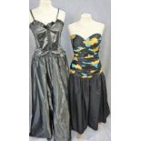 JOHN CHARLES: A 1980'S FULL LENGTH CHARCOAL GREY EVENING DRESS, thin shoulder straps attached to a