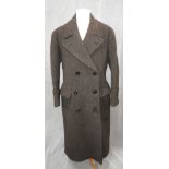 A GENTLEMAN'S FULL LENGTH WINTER COAT, the centre pleated back with half-swing fitted belt, the