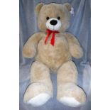 A LARGE TEDDY BEAR BY "HUGS" 120 cms high, sold for The Weldmar Hospicecare Trust