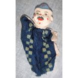 A VINTAGE GLOVE PUPPET OF A POLICEMAN