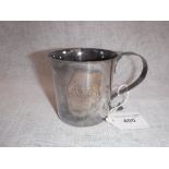 A SILVER MUG with scrolled handle, inscribed 'RVF 24.12.67' (c.207gms)