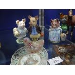 THREE BESWICK BEATRIX POTTER FIGURES of Aunt Pettitoes, Little Pig Robinson, and Pigling Bland, a