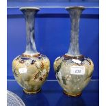 A PAIR OF ROYAL DOULTON GLAZED VASES with blossom decoration, 26 cm high